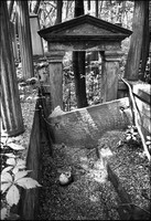 Vandalized tomb in Jewish Cemetery, Warsaw. It was believed by the local people that, when buried, Jews hide gold with the corpse.  1975 