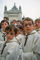 Altar boys in Lisieux, France following Pope John Paul II outdoor mass. 1980