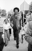 Jesse Jackson escorting 2 girls to the first day of school as per a voluntary busing program in Chicago.